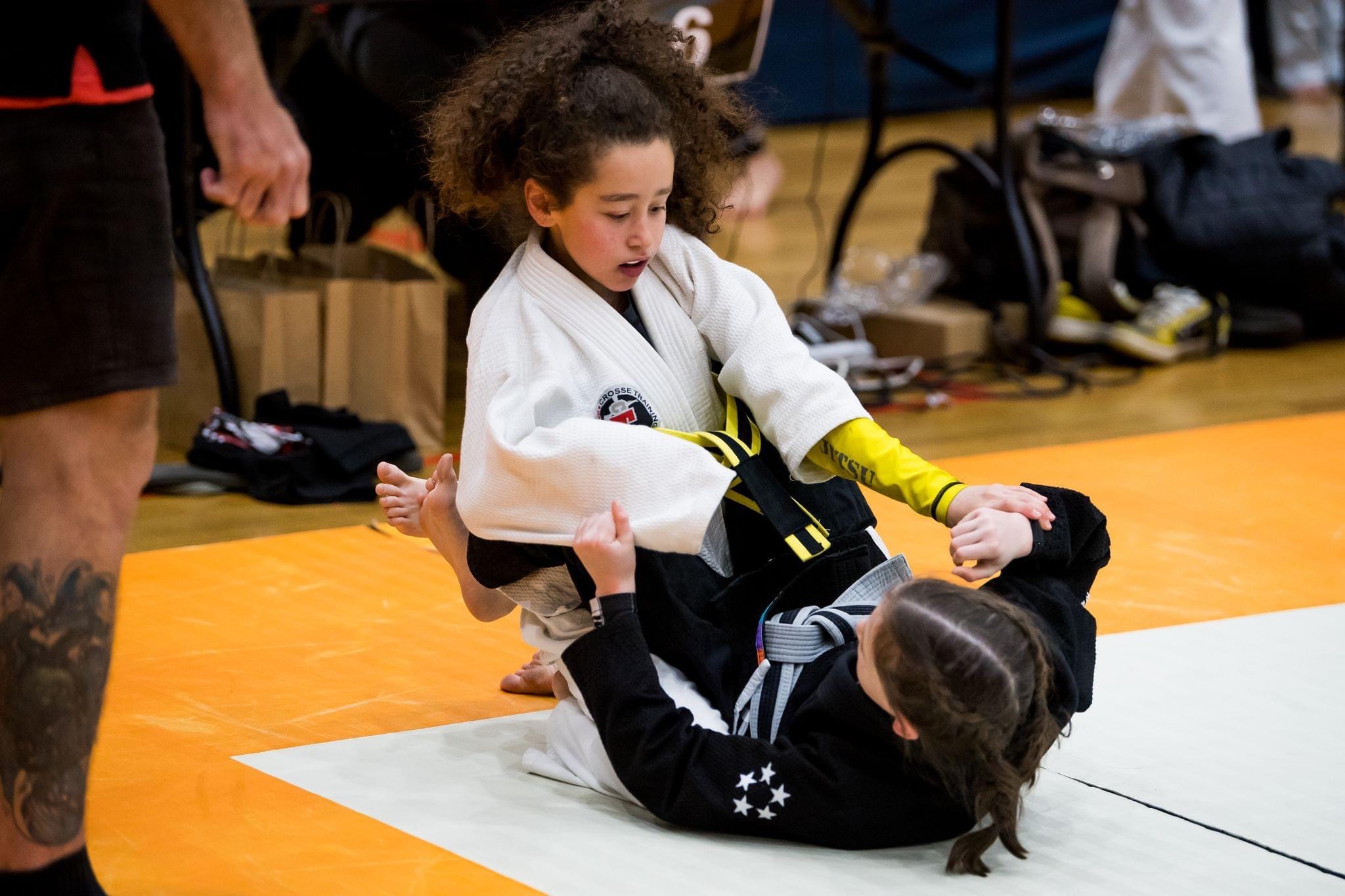 Three young Crosse Training athletes with medals after competition