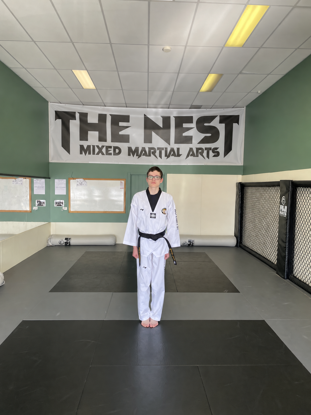 Michael wearing his newly achieved Taekwondo black belt at The Nest
