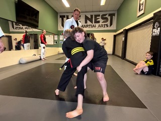 Two young Crosse Training students practising a standing jiu-jitsu technique