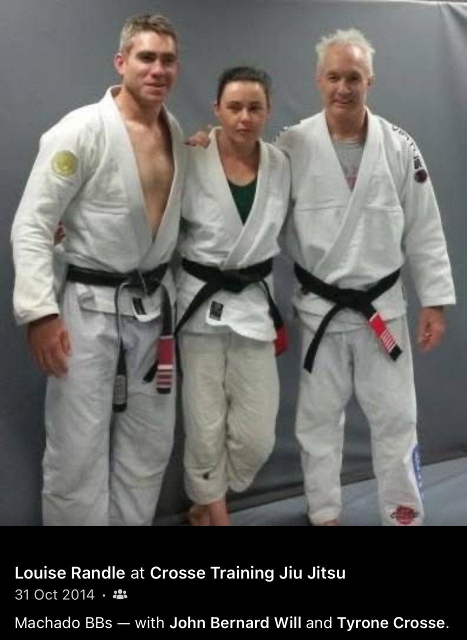 Tyrone Crosse, Louise Randle and John Will in Jiu-Jitsu uniforms in a 2014 group photo